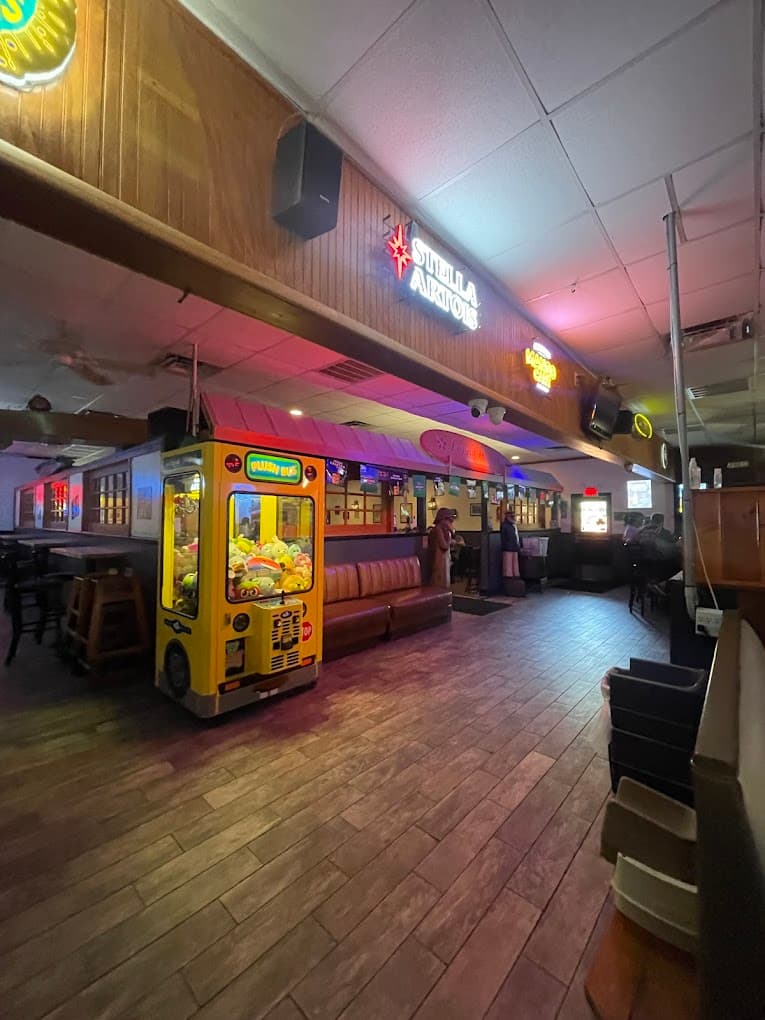 Inside — neon signs and claw machine