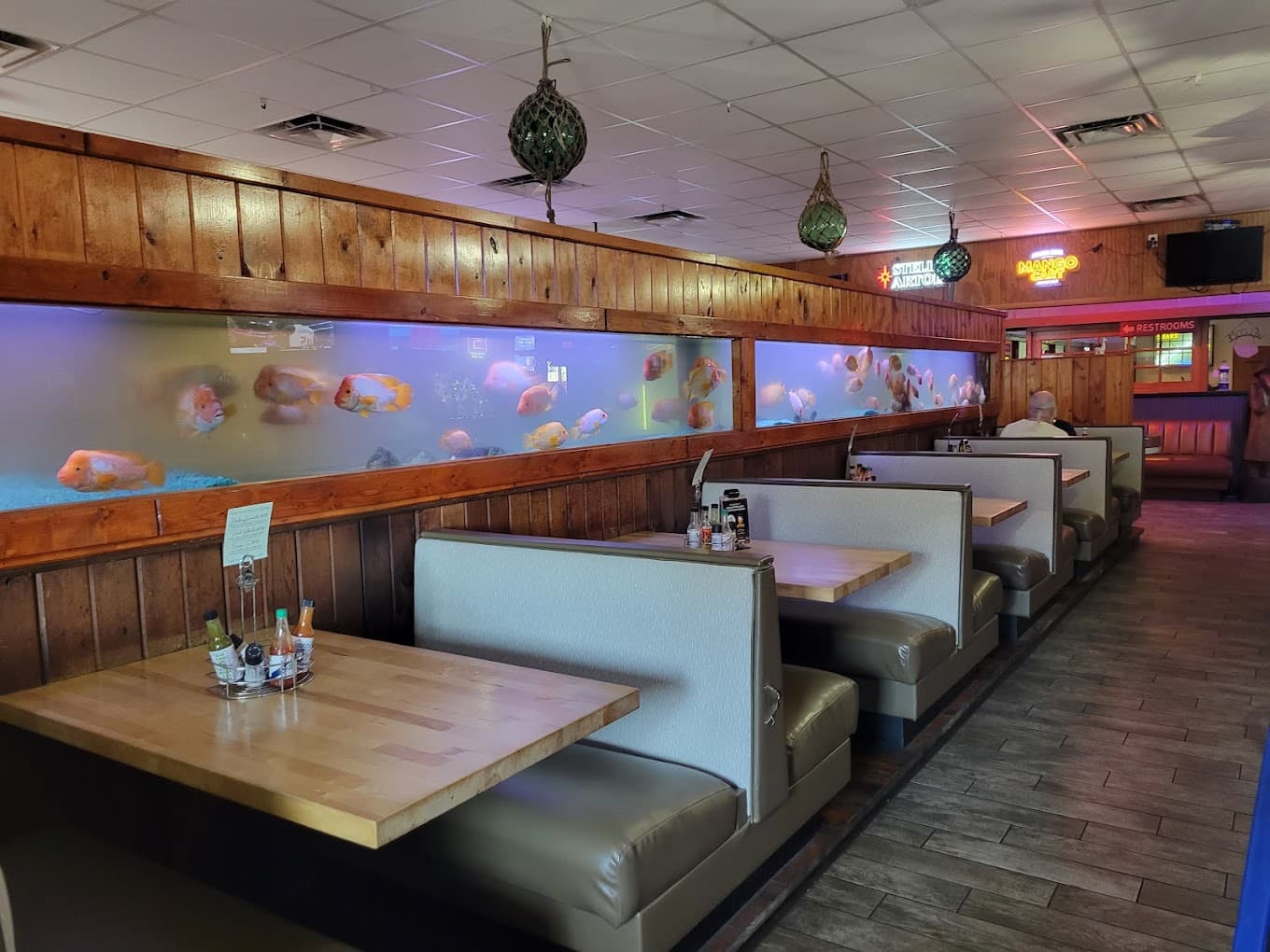 Booths alongside the fish tank