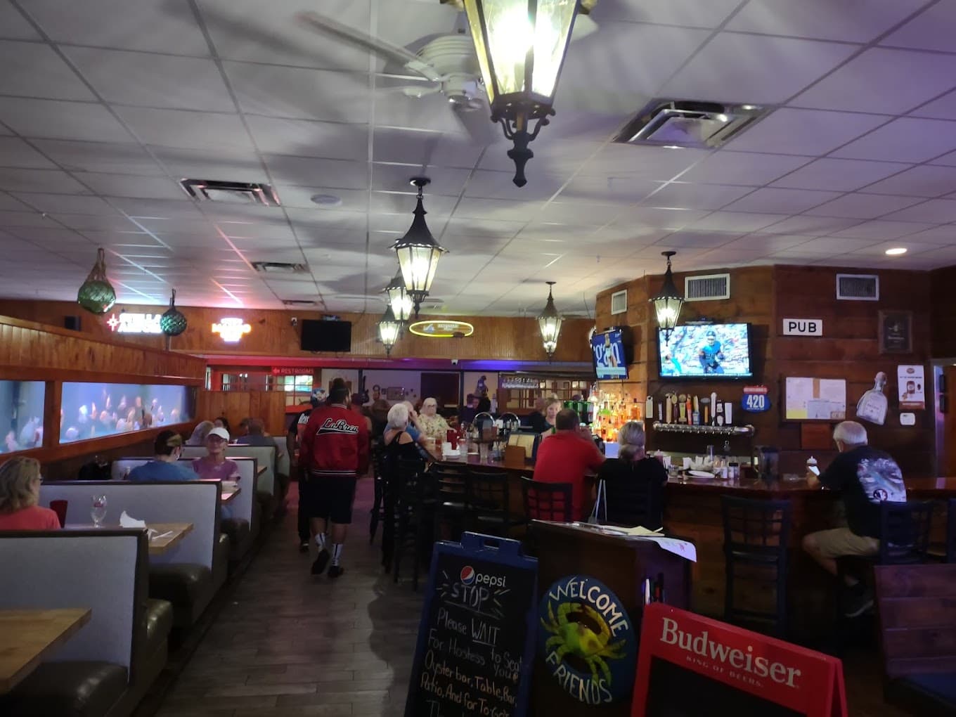 The bar packed with regulars watching the game